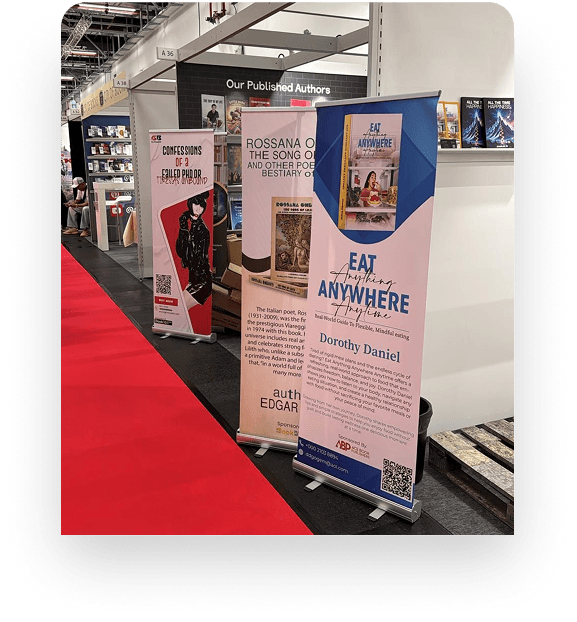 Book fair banners standing beside a display of novels