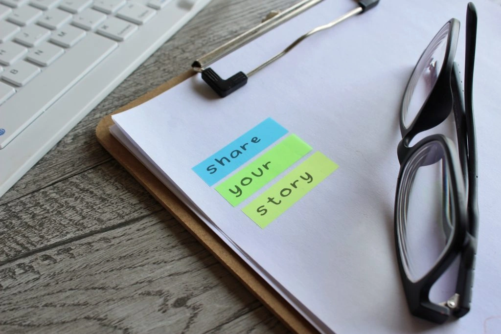Notebook, pen, and story outline on a desk